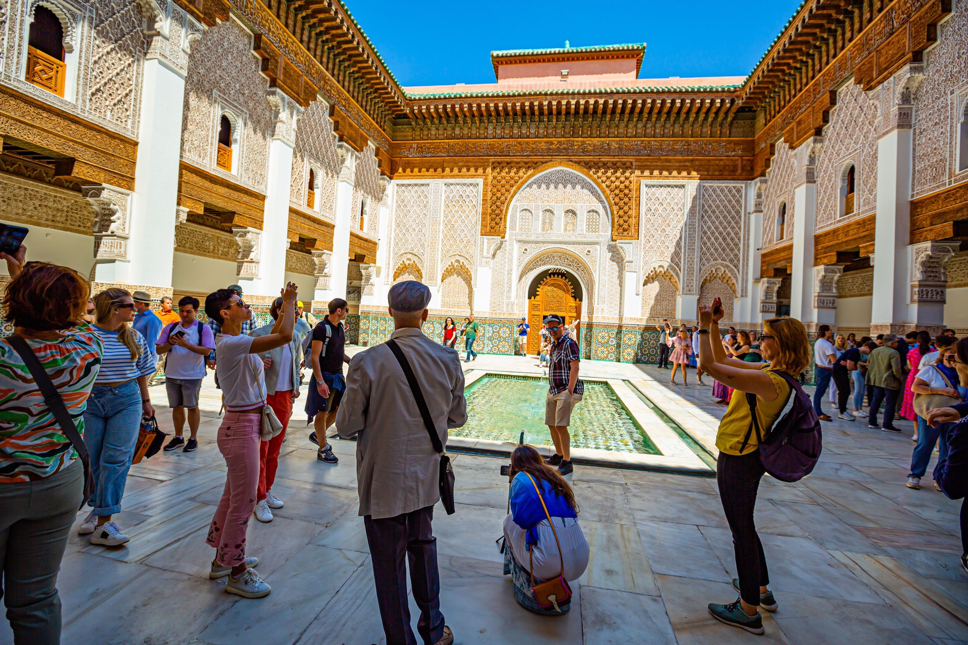 More tourists visit and take photos in the Ben Youssef Medersa,old Koranic school,Marrakech,Morocco